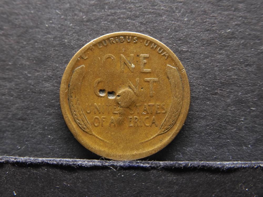 1910 wheat penny clipped planchet error showing curved bite missing from the coin edge